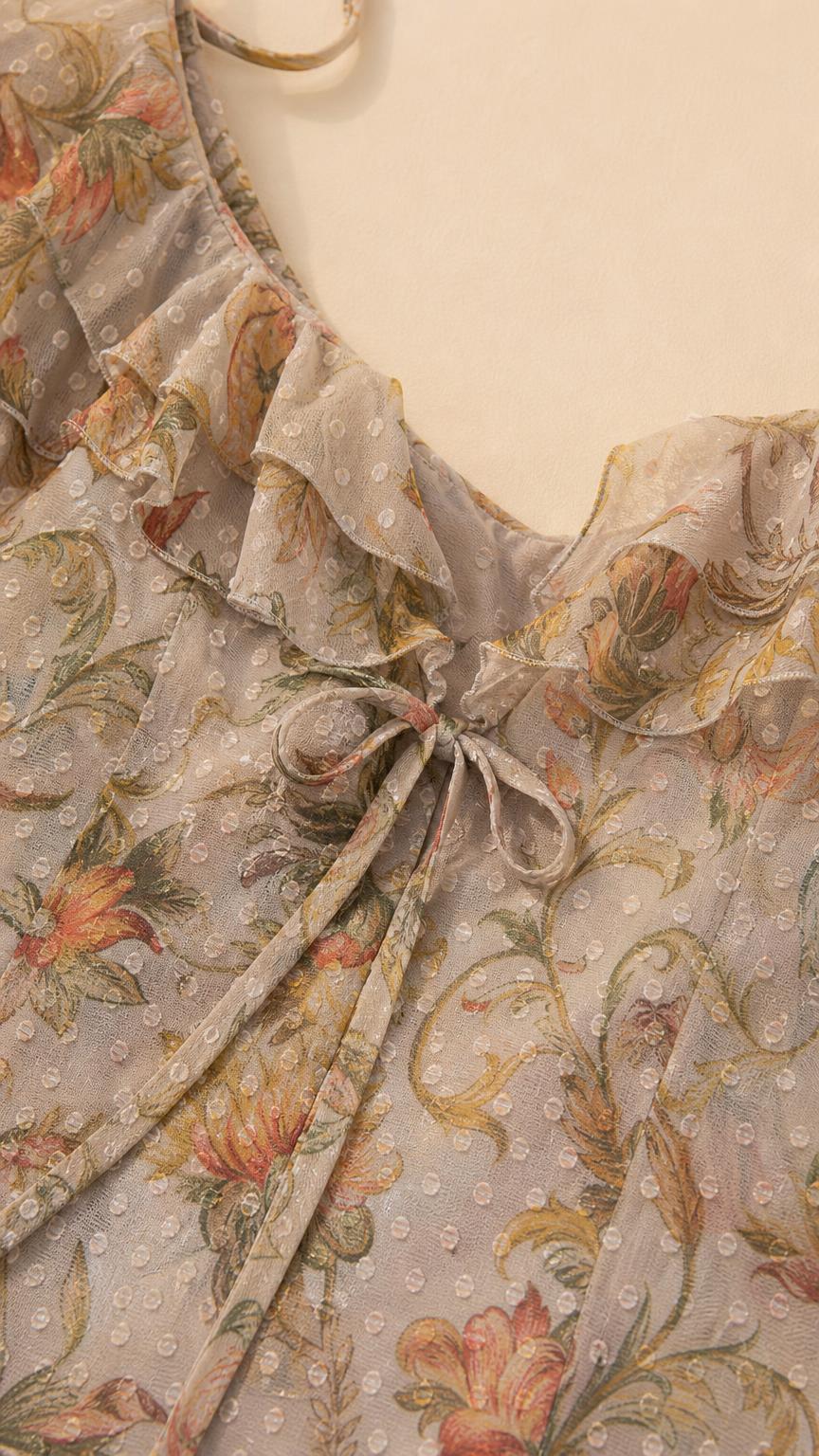 Close-up detail of sweetheart neckline, bust tie, and ruffle trim