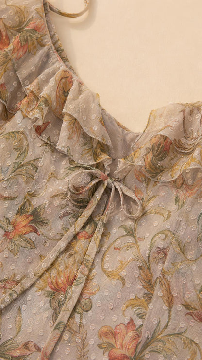 Close-up detail of sweetheart neckline, bust tie, and ruffle trim