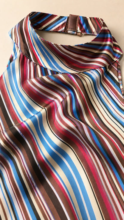 Close-up fabric and collar detail of the multicolored striped halter dress