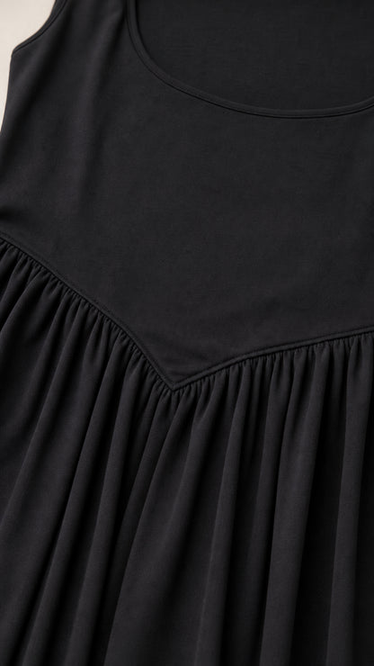 Close-up detail of square neckline and drop-waist seam