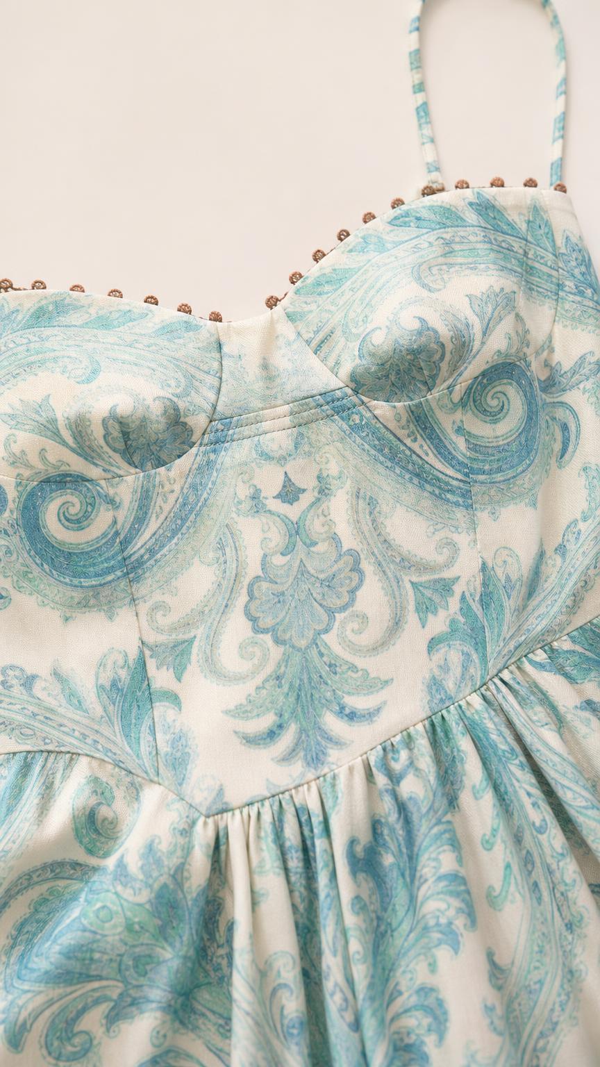 Close-up of sweetheart neckline and paisley pattern