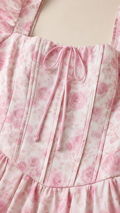 Close-up of square neckline and corset seaming on pink floral dress