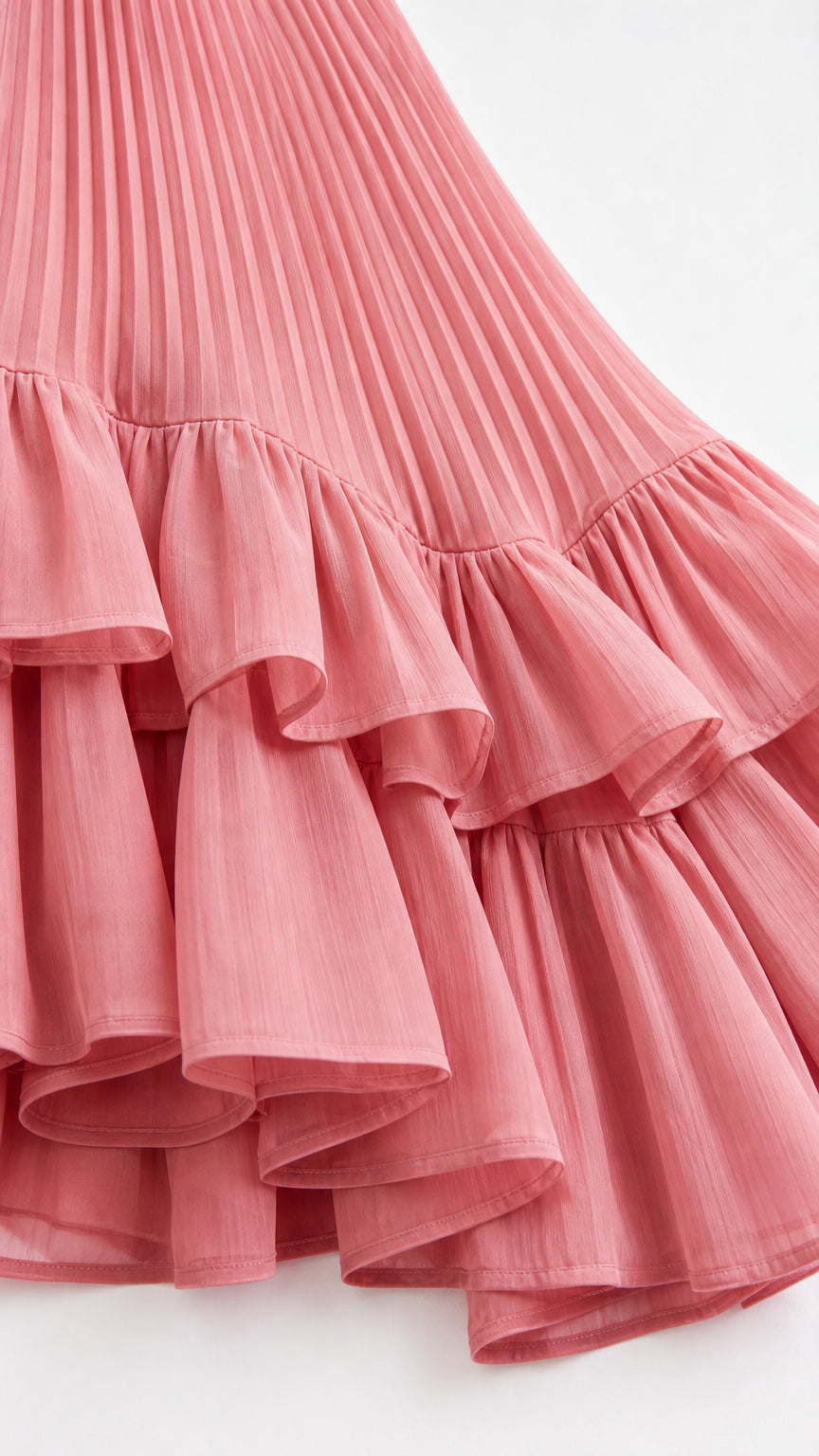 Close-up of pleated fabric and tiered ruffle hem detail