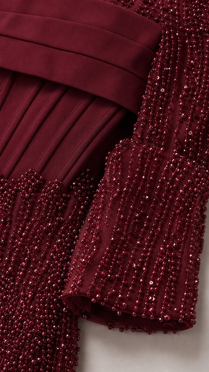 Close-up of the beadwork texture and structured bodice overlay