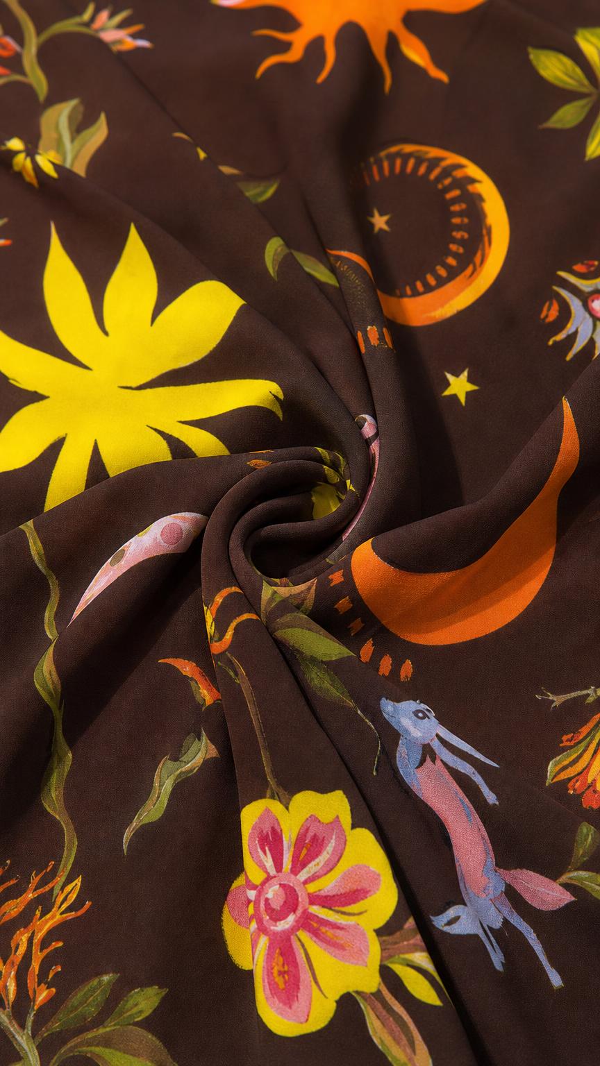 Close up texture view of the brown celestial print fabric