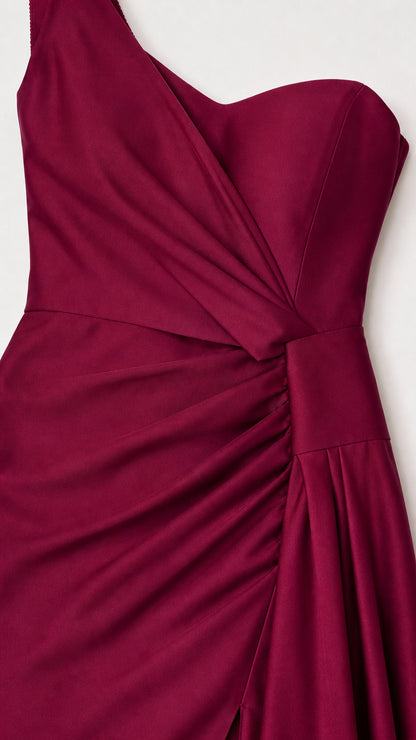 Close-up detail of one-shoulder bodice and ruching