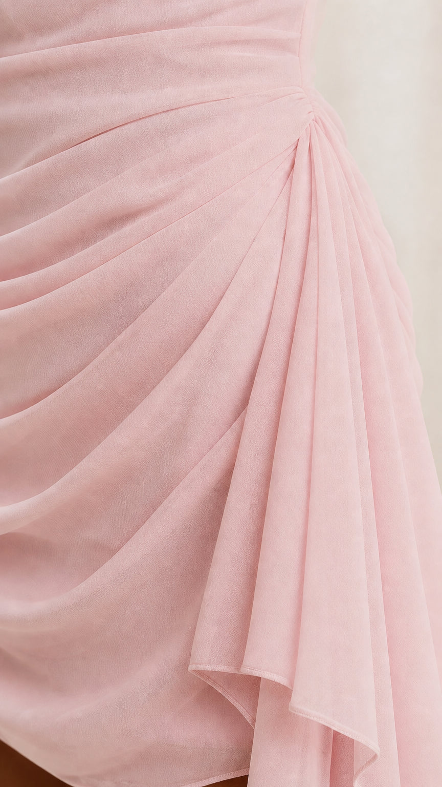 Close-up detail of pink chiffon fabric and draping