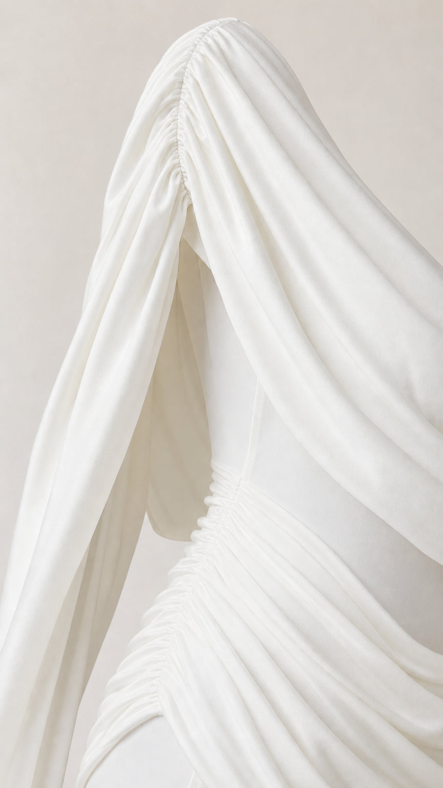 Close-up detail of White draped cowl collar and gathered waist