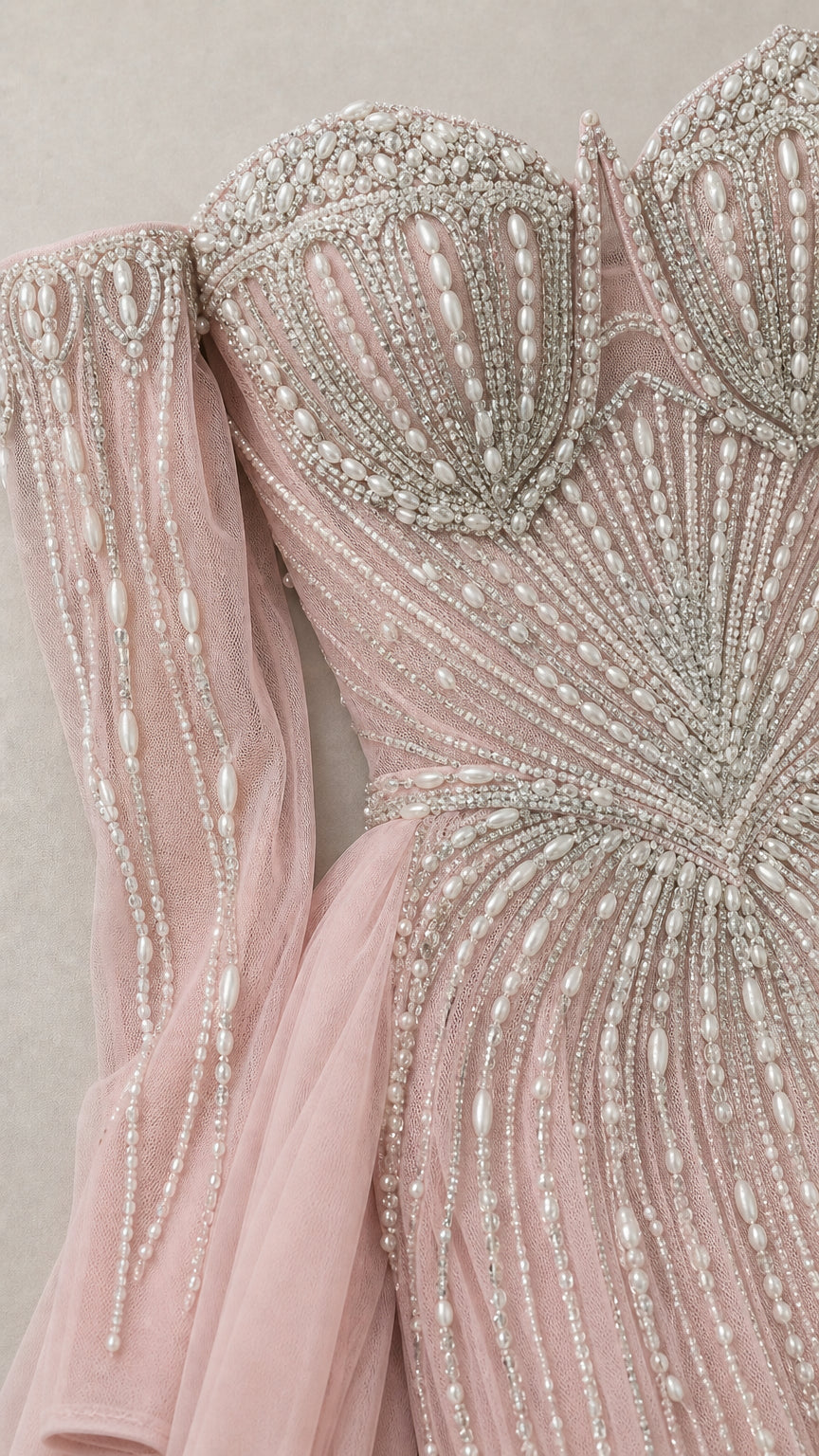 Close-up detail of crystal and pearl bodice embellishments and sleeves