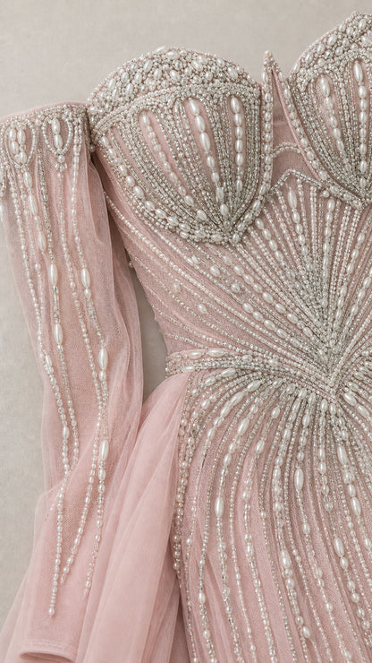 Close-up detail of crystal and pearl bodice embellishments and sleeves