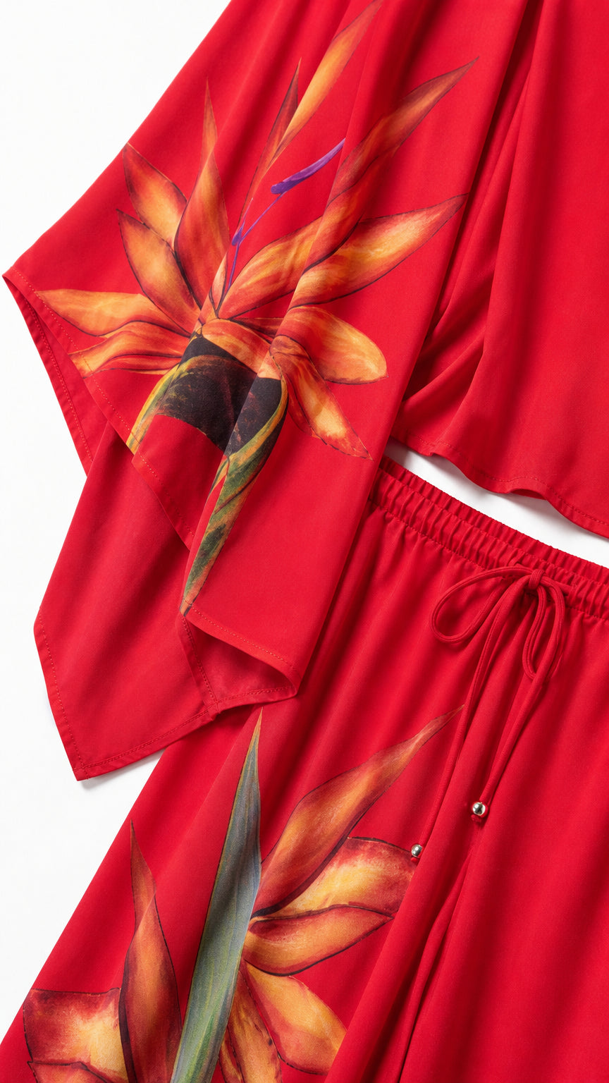 Close-up detail of the floral print sleeve and drawstring waistband