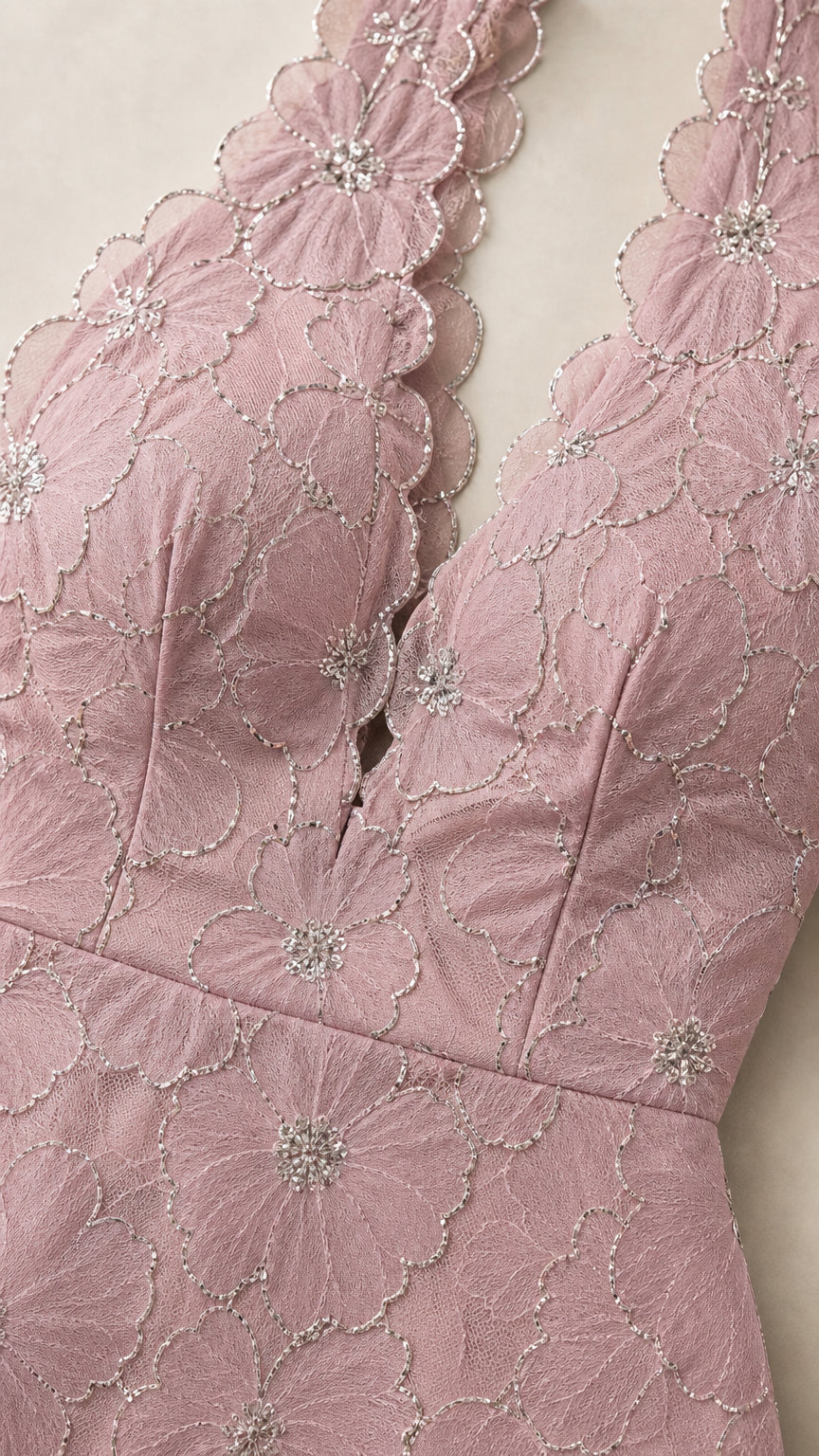 Close-up of floral scalloped plunge halter neckline with beadwork accents