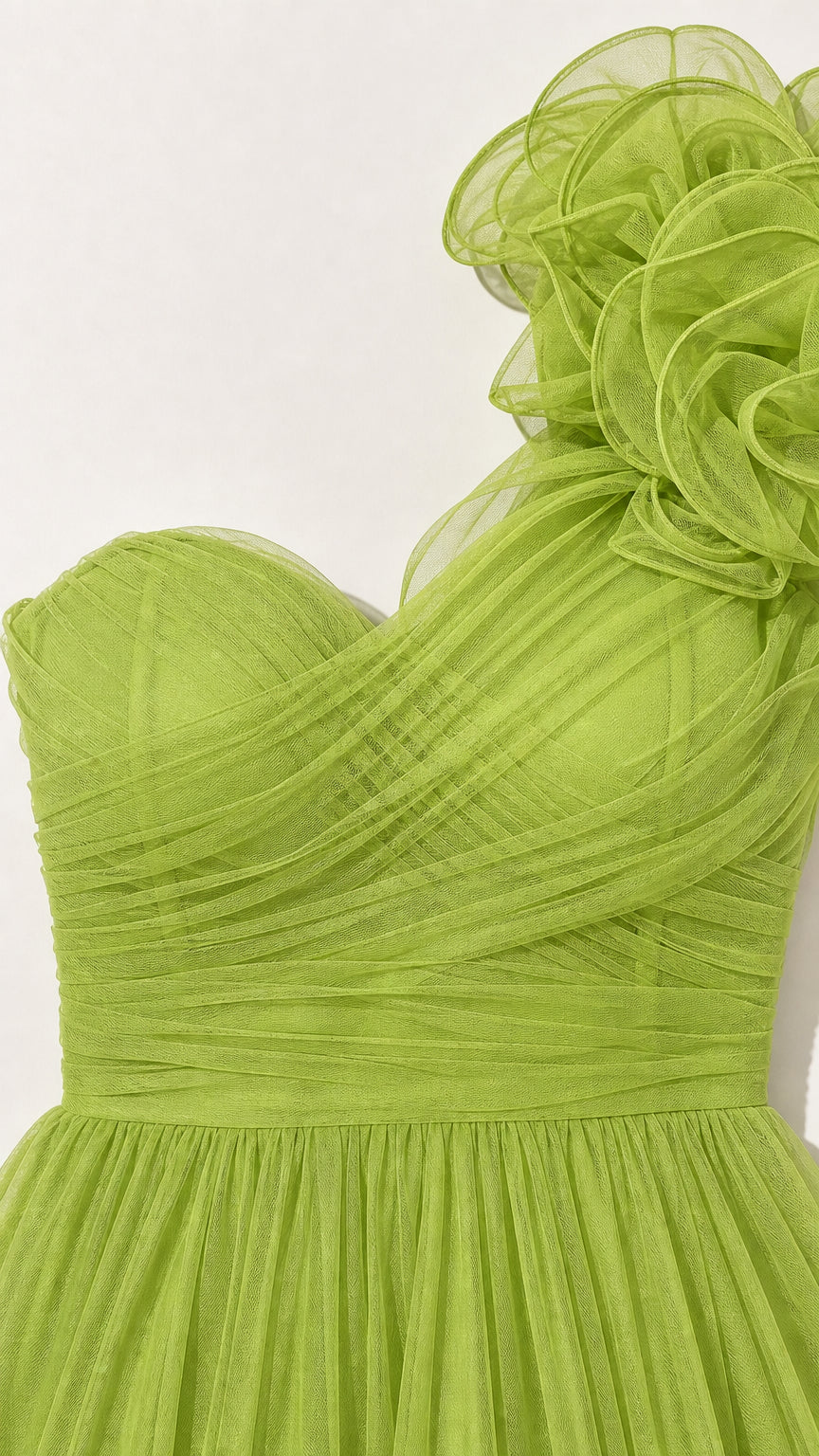 Close-up detail of bodice and shoulder rosette on green gown