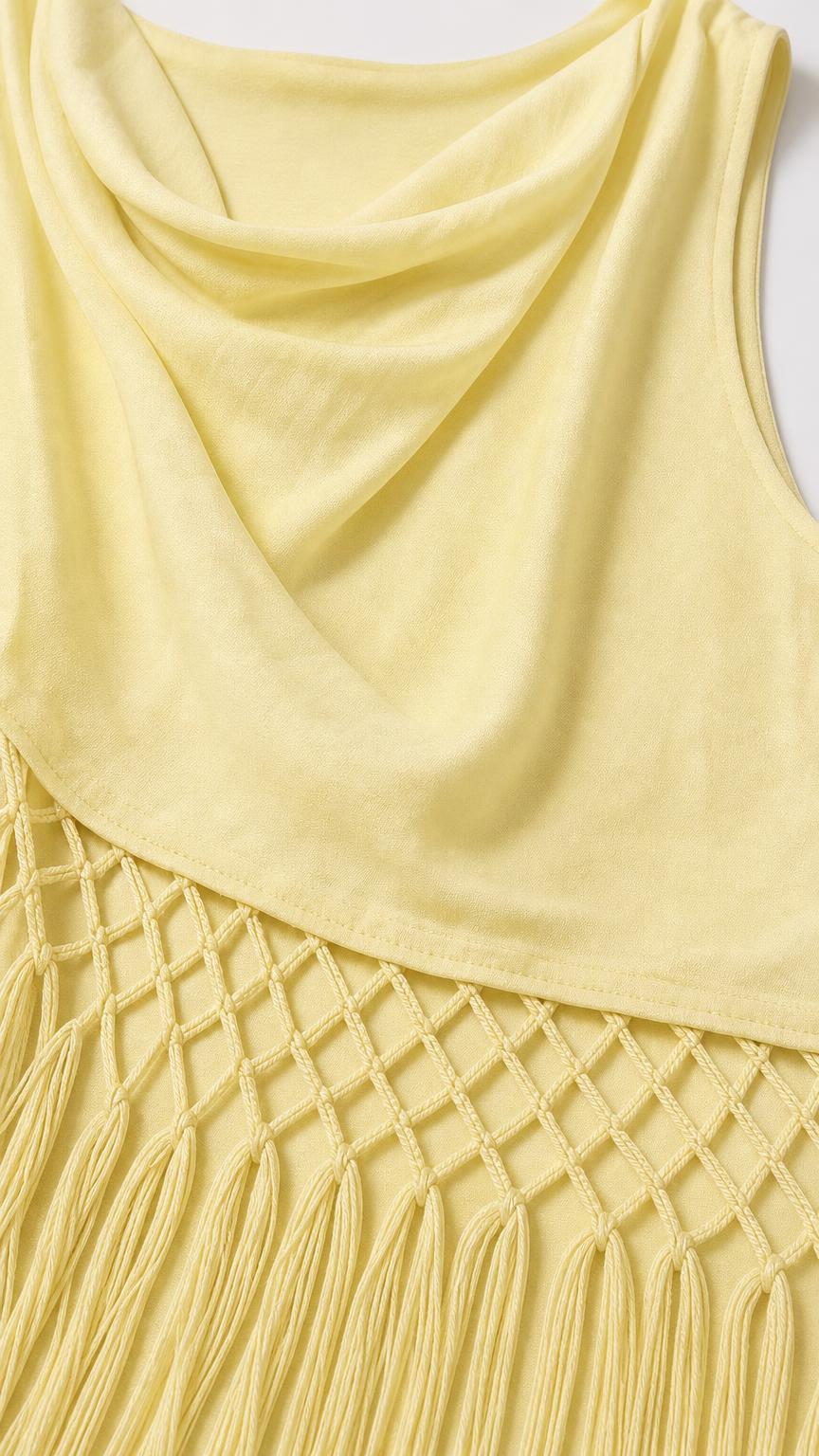 Close-up detail of yellow cowl neckline and net-knot fringe hem