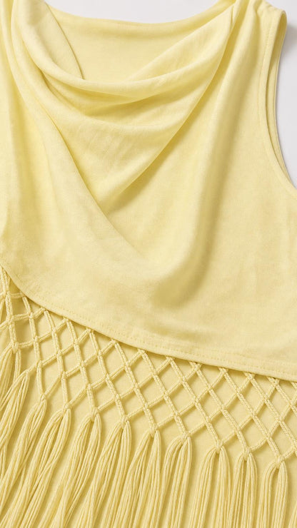 Close-up detail of yellow cowl neckline and net-knot fringe hem