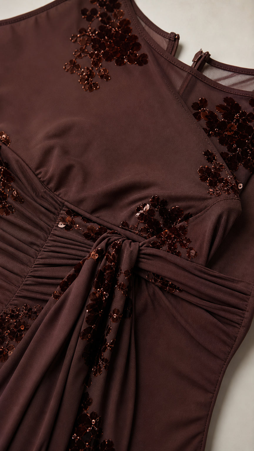 Close-up of bodice, floral appliques, and draped waist