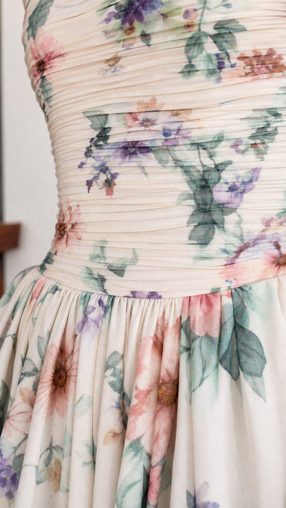 Close-up detail of ruched bodice and floral print fabric