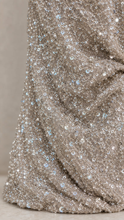 Close-up detail of shimmering silver sequin fabric texture