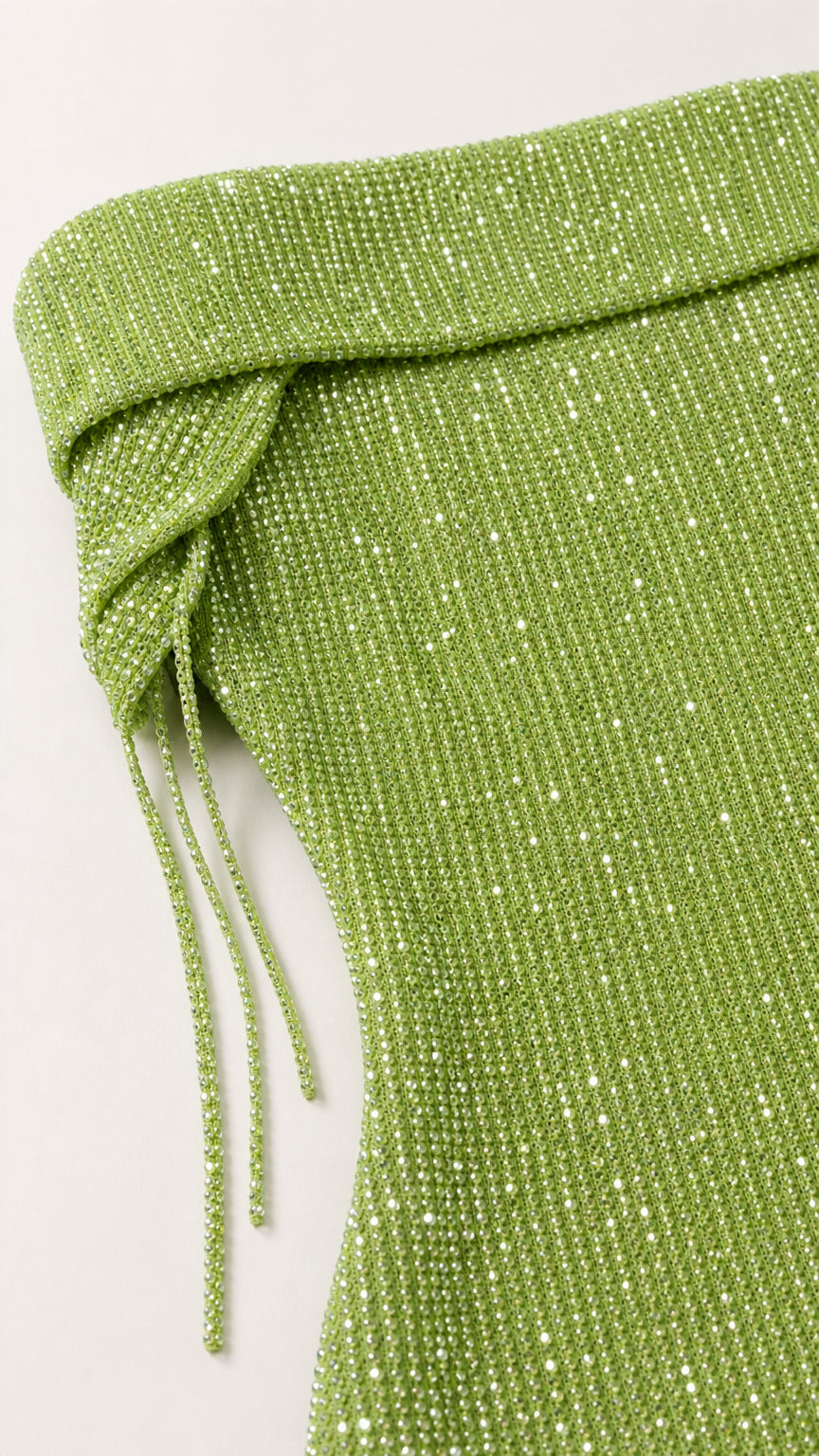 Close-up of green glittering foldover neckline and texture