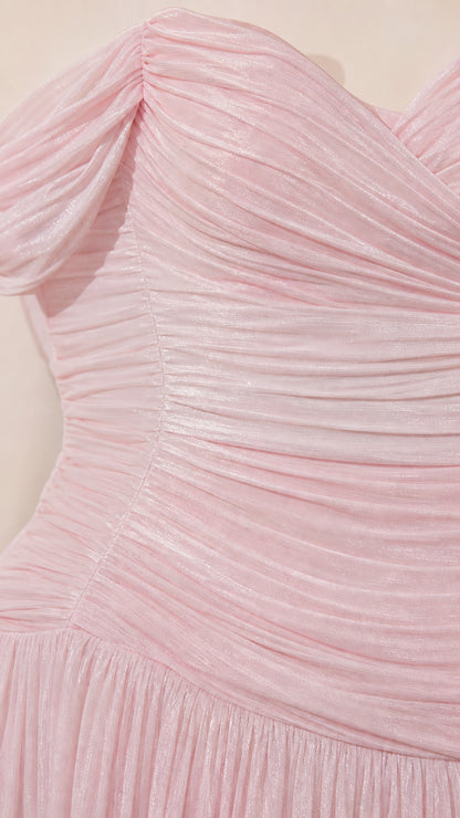 Close-up detail of draped bodice and ruching on pink gown