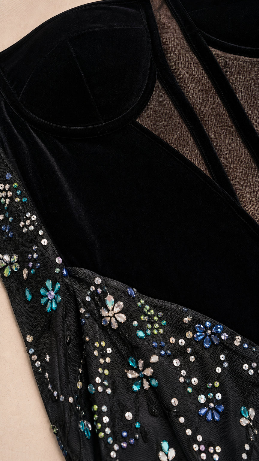 Close-up detail of bodice and sequin embroidery on black gown