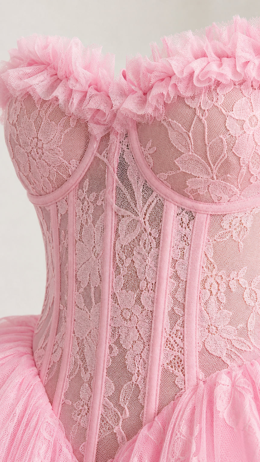 Close-up detail of structured lace corset bodice and ruffles