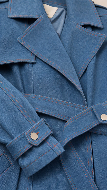 Close-up detail of Denim Blue jacket lapel, fabric weave, cuff tab, and contrast stitching