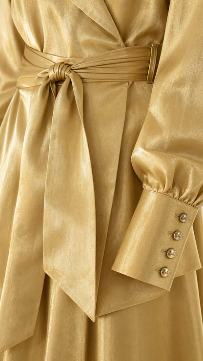 Close-up detail of the waist tie belt and buttoned cuffs on the Champagne Gold satin blazer