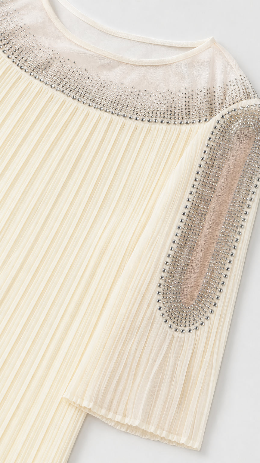 Close-up detail of sheer illusion neckline and sleeve cutout with sparkling rhinestone trim