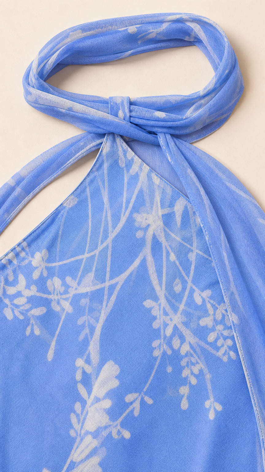 Close up of blue floral halter neck construction and fabric texture