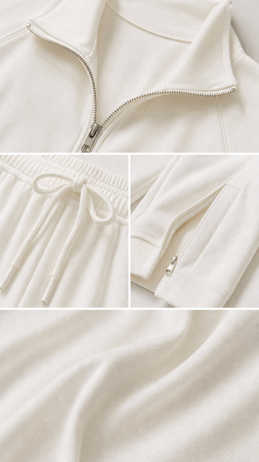 Close-up details of off-white tracksuit zipper, drawstring waistband, and soft fabric texture