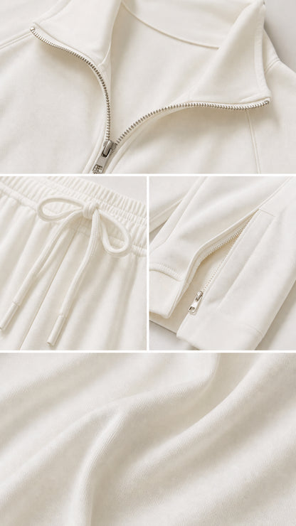 Close-up details of off-white tracksuit zipper, drawstring waistband, and soft fabric texture