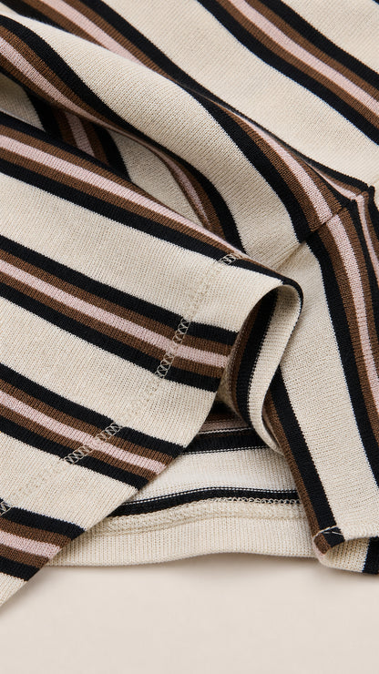 Close up texture view of beige striped knit fabric