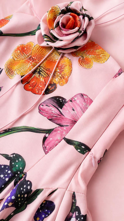 Close-up detail of 3D rose choker and floral print fabric