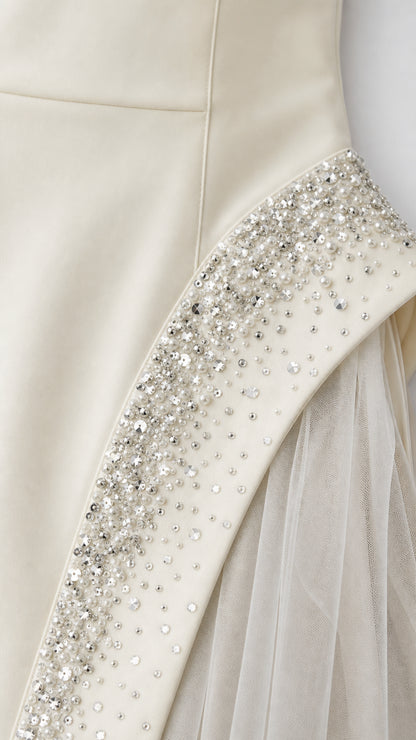 Close-up of rhinestone and crystal embellishments on ivory gown