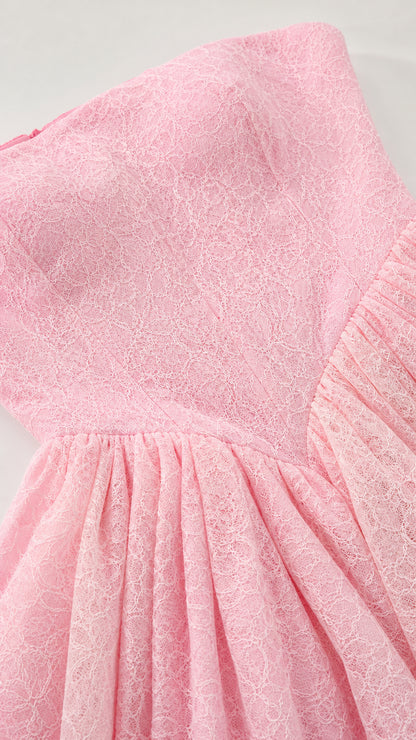 Close-up texture of delicate pink floral lace fabric and basque waist seam