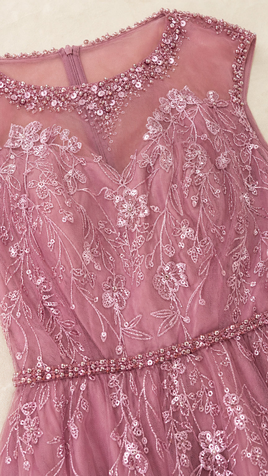 Close-up of beaded illusion neckline and floral embroidery on mauve gown
