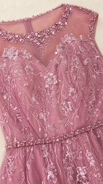 Close-up of beaded illusion neckline and floral embroidery on mauve gown