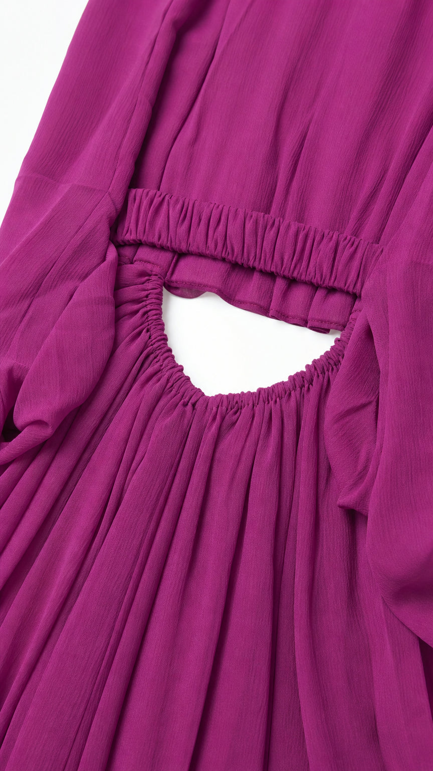 Close up of elasticated gathered waistband and back cutout on magenta dress