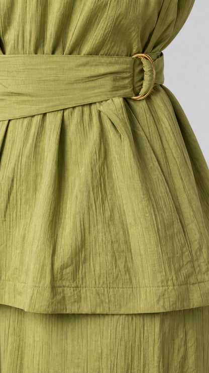 Close up of belt buckle and textured fabric on sage green set