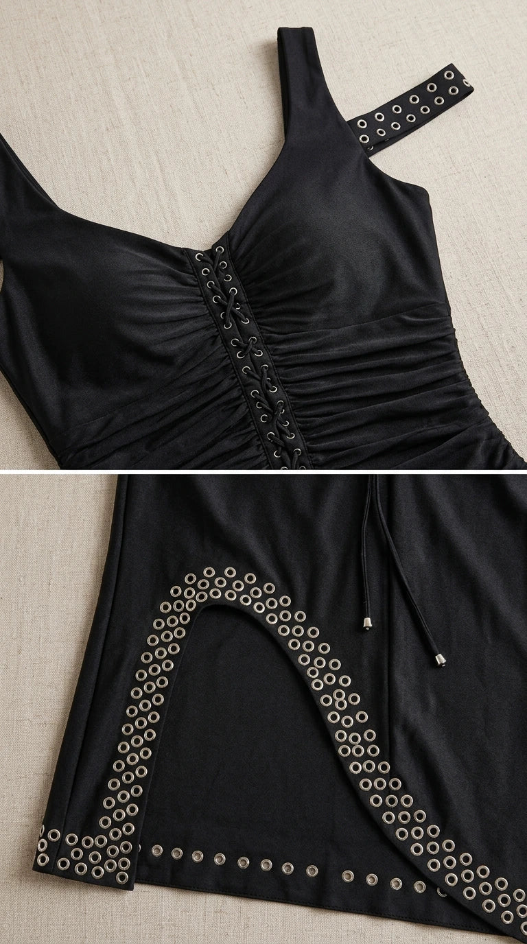 Close up of bodice and grommet hem details on black dress