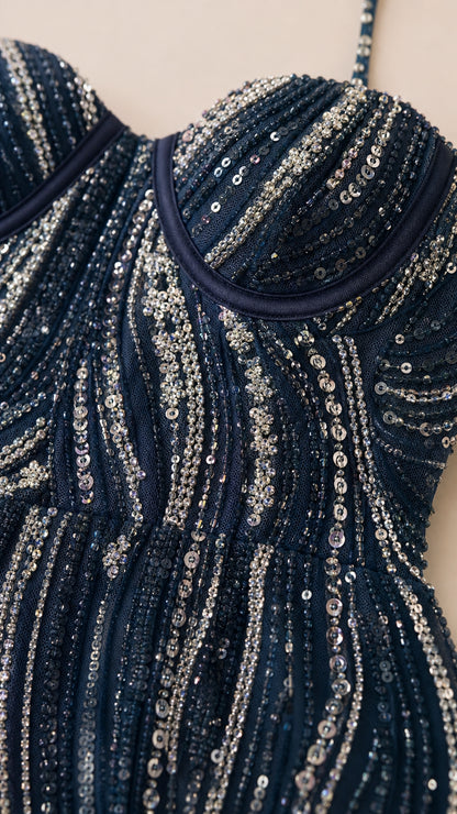 Close-up detail of sequin and bead pattern on structured bust
