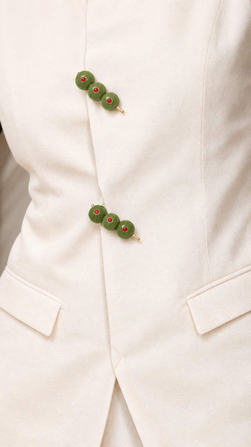 Close-up of olive-cluster buttons and front pocket detail