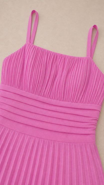 Close-up detail of fuchsia dress bodice and straps