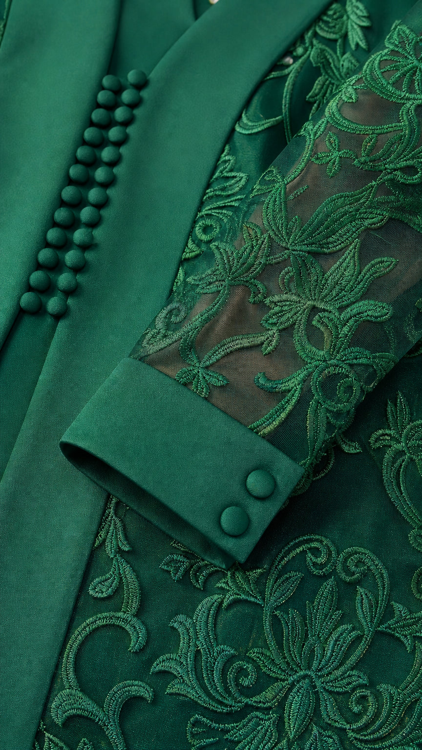 Close-up detail of green lace sleeve and button accents