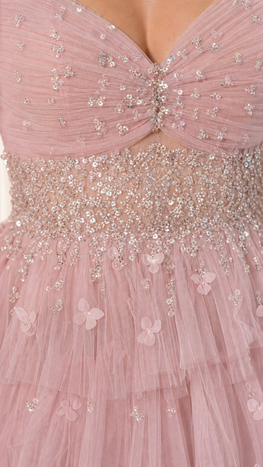 Close-up detail of beaded waistband, floral accents, and pleated tulle bodice