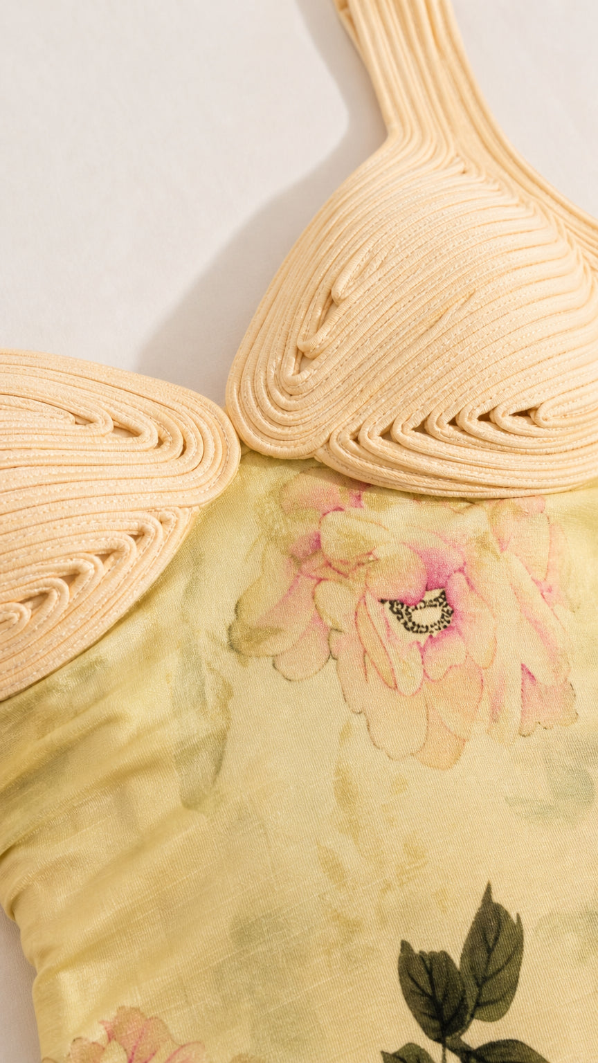 Close-up detail of textured bodice and floral fabric