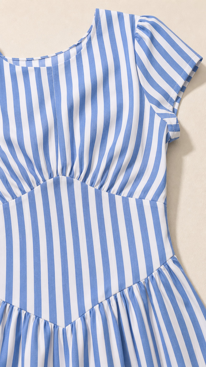 Close-up detail of blue striped fabric and bodice