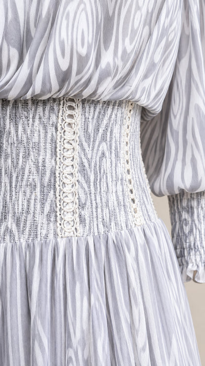 Close-up detail of smocked waist and textured fabric on Light Grey dress