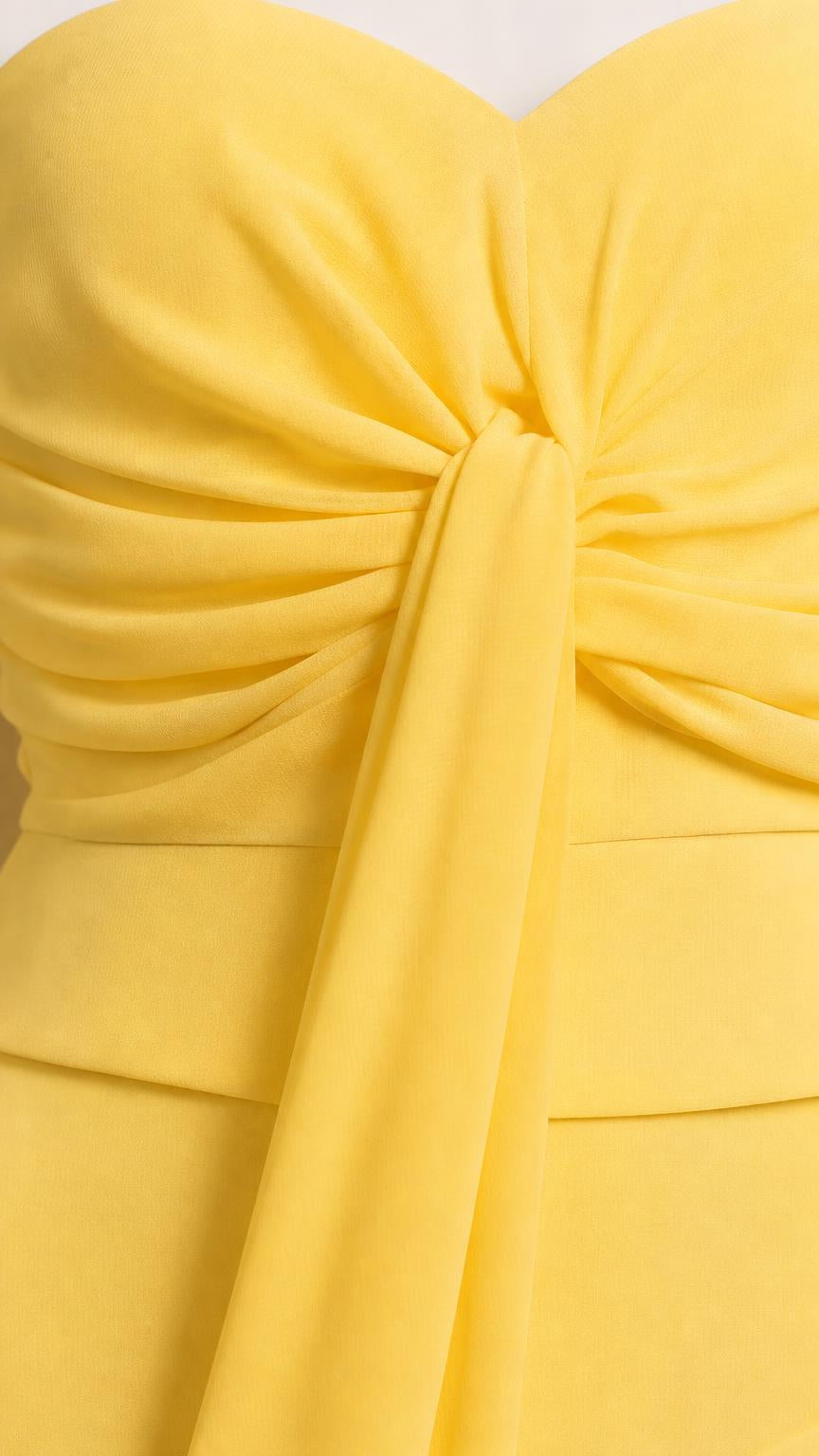Close-up of front knot and bodice detail on yellow dress